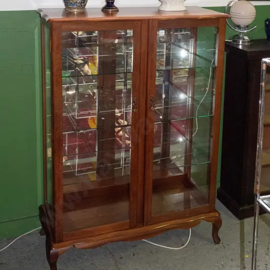 vintage mahogany 2-door display case with glazed sides, 3 fixed glass shelves and mirrored back on squat cab legs, white