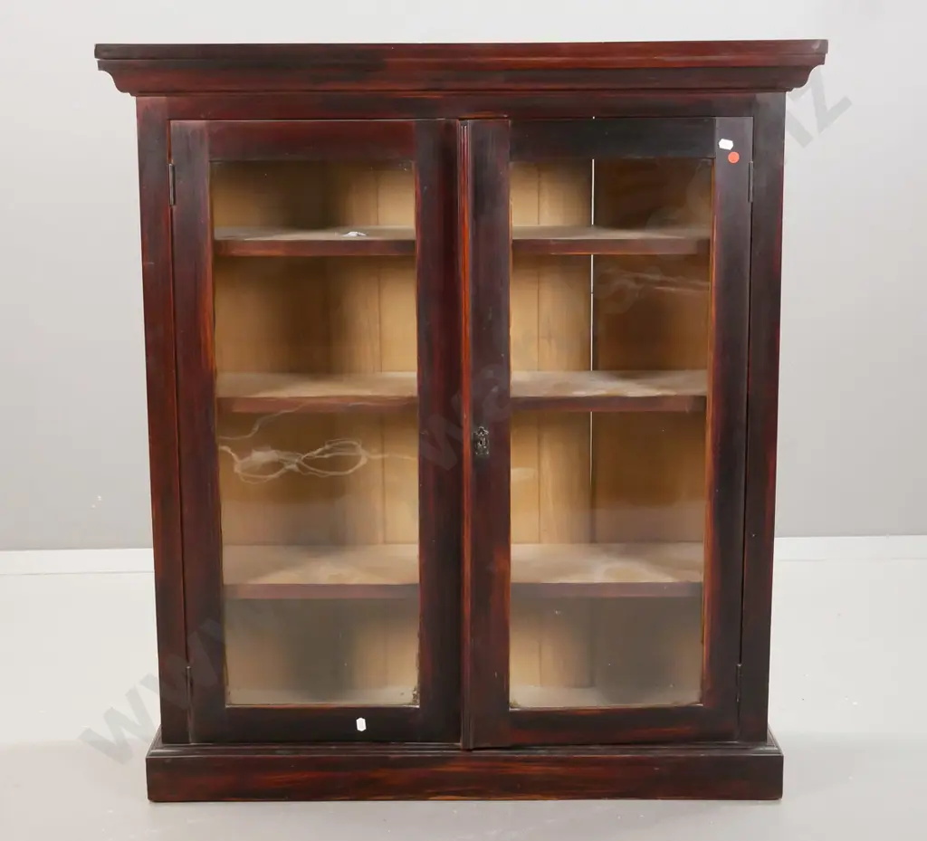 Edwardian dark stained rimu glazed book-case with 3 adjustable shelves, top over shaped moulded edge has slight bow, Image 1++