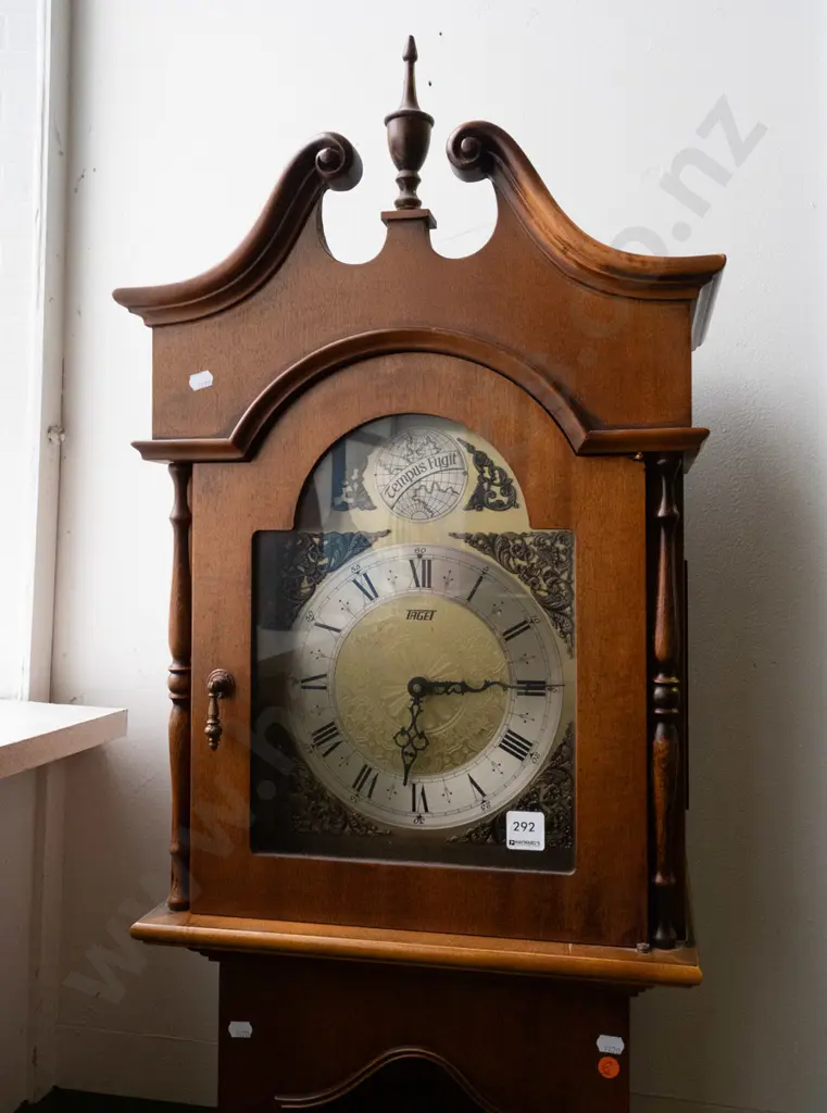 1970s long-case clock w/ brass and silver dial marked "Taget" arched top globe with Tempus Fugit inscription, arched Image 1++