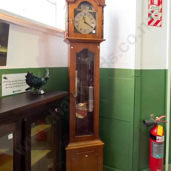 1970s long-case clock w/ brass and silver dial marked "Taget" arched top globe with Tempus Fugit inscription, arched