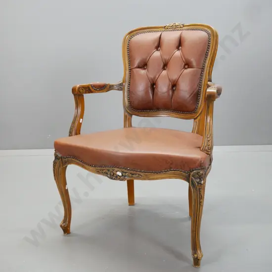 vintage walnut French-style open-armed armchair with deep-button and studded leather seat, and back, buttons on back.