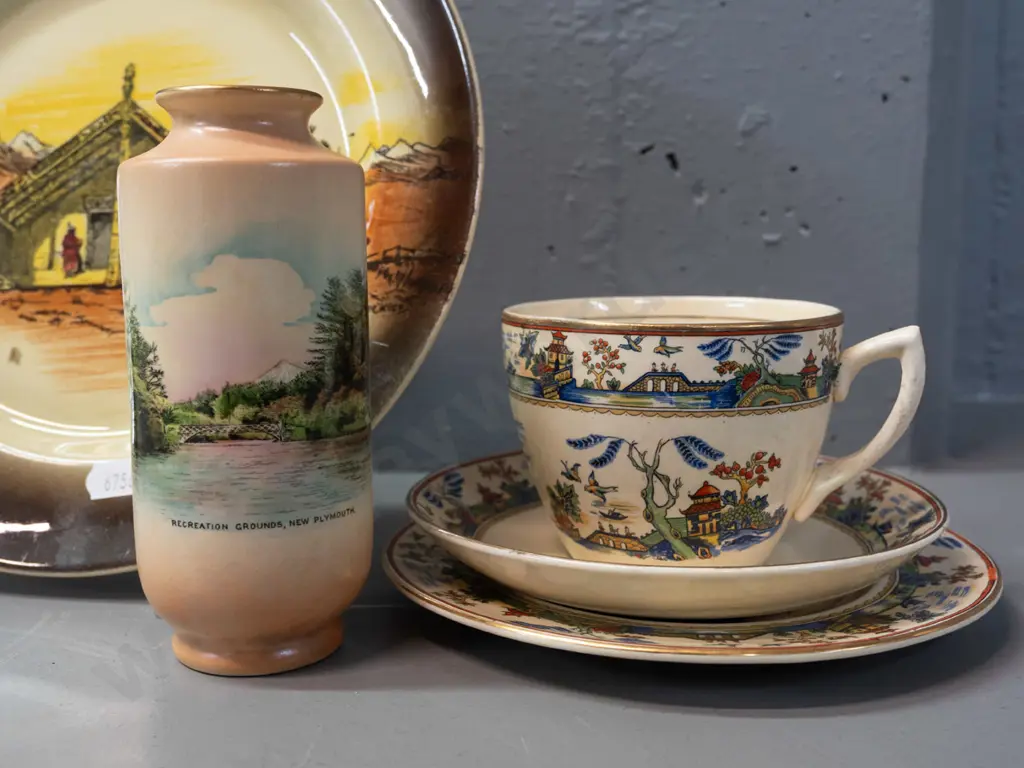 AJ Wilkinsons New Zealand Homeland Series display plate, New Plymouth souvenir Shelley vase and a Clarice Cliff Newport Image 1++