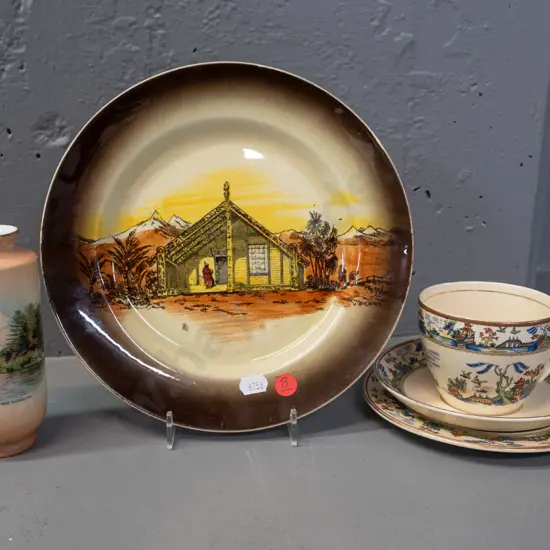 AJ Wilkinsons New Zealand Homeland Series display plate, New Plymouth souvenir Shelley vase and a Clarice Cliff Newport