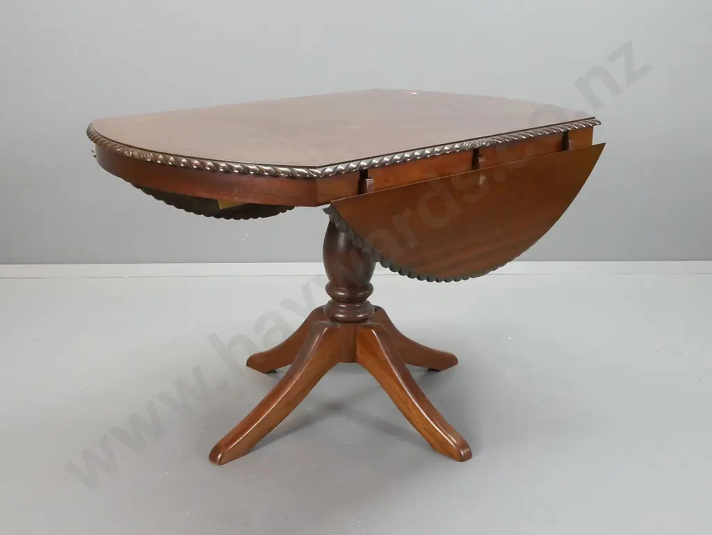 mahogany reproduction regency style drop-side table on pedestal base with 4 sweeping legs, rope edged top, 2 leaves Image 1++