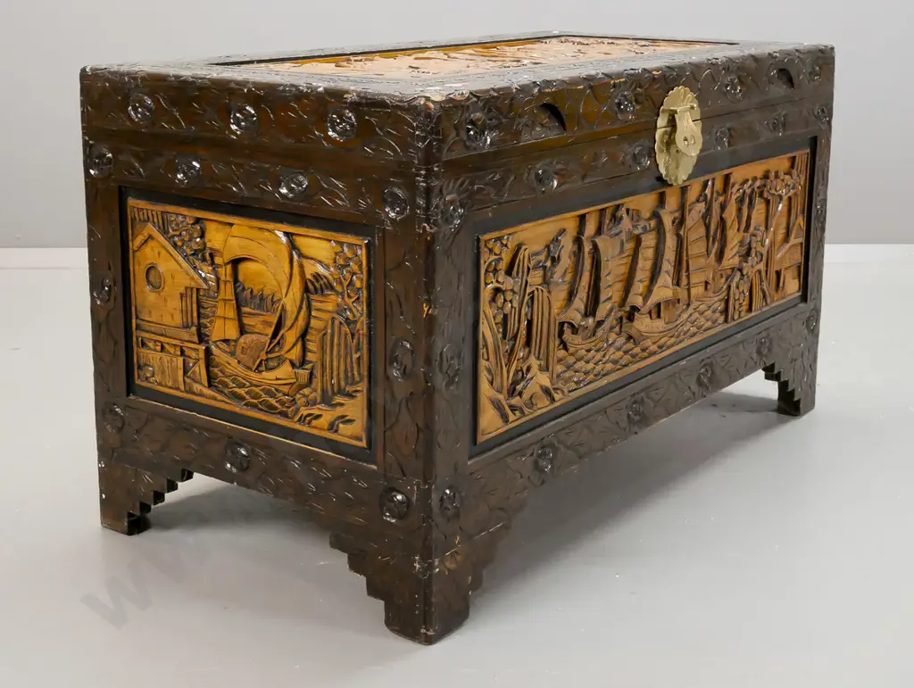 asian heavily carved camphorwood lined chest with brass lock plate and latch but no lock - some wear on corners of top Image 1++