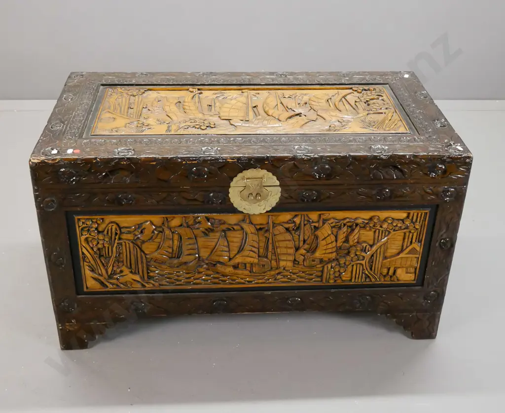 asian heavily carved camphorwood lined chest with brass lock plate and latch but no lock - some wear on corners of top Image 1++