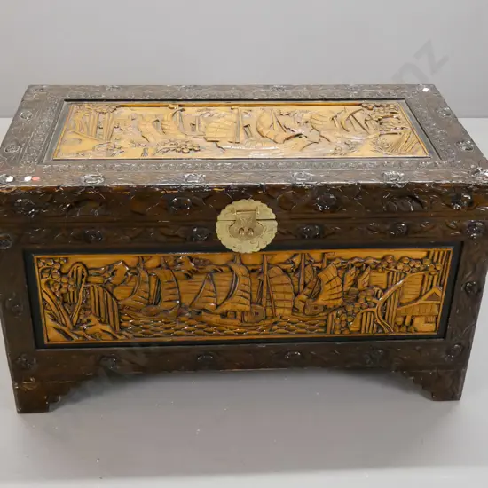 asian heavily carved camphorwood lined chest with brass lock plate and latch but no lock - some wear on corners of top