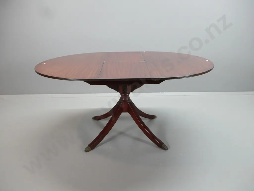 reproduction Regency style dining table and 6 chairs, extending from round to oval with hinged flip-up leaf, cross- Image 1++