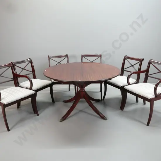 reproduction Regency style dining table and 6 chairs, extending from round to oval with hinged flip-up leaf, cross-