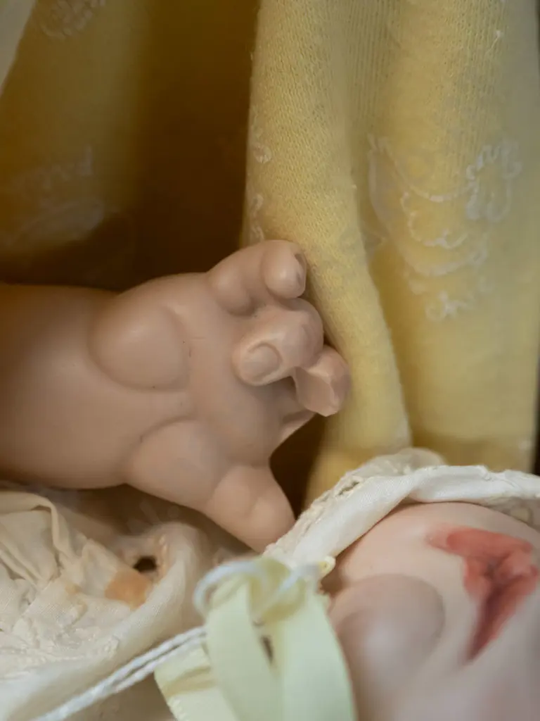 2 porcelain dolls, both by Pauline Lewis - girl marked Paris & sleeping infant with blanket marked 1988 - clothing on Image 1++