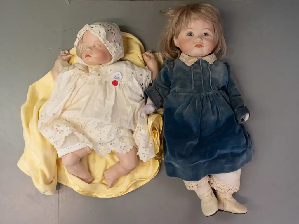 2 porcelain dolls, both by Pauline Lewis - girl marked Paris & sleeping infant with blanket marked 1988 - clothing on Image 1++
