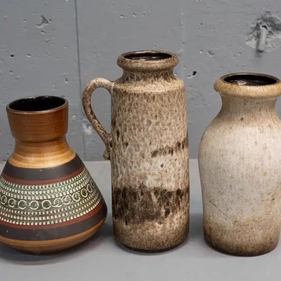 3 German pottery items - 3 vases including a  jug vase, short banded sgraffito style - largest is handled jug H-200