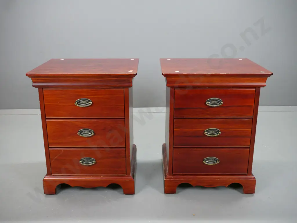 Reproduction 3 drawer, pacific kauri bedside cabinets with stepped top on shaped plinth, oval brass handles. Image 1++