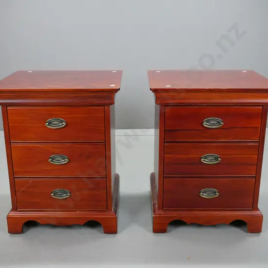 Reproduction 3 drawer, pacific kauri bedside cabinets with stepped top on shaped plinth, oval brass handles.