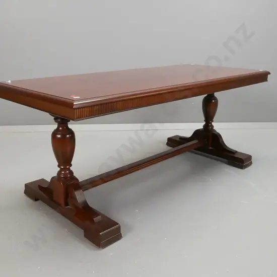 coffee table with mahogany veneer top, beech stretcher base with turned supports, fluted edge to top - a few heat marks