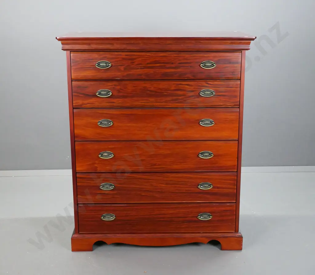 Reproduction 6 long drawer, pacific kauri chest,  with stepped top on shaped plinth, oval brass handles. Image 1++