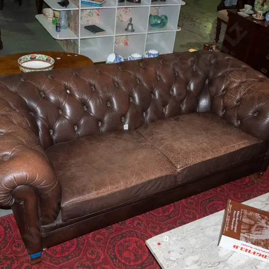 vintage rolled arm brown leather chesterfield settee with pleated deep button arms and back, 2 removable squabs, wooden