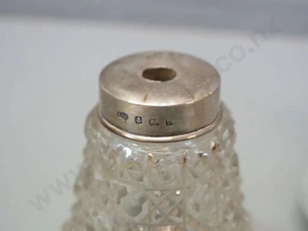 6 vintage scent bottles and a small bowl, 4 w/ sterling silver caps or collars, one enamelled sterling. One missing Image 1++