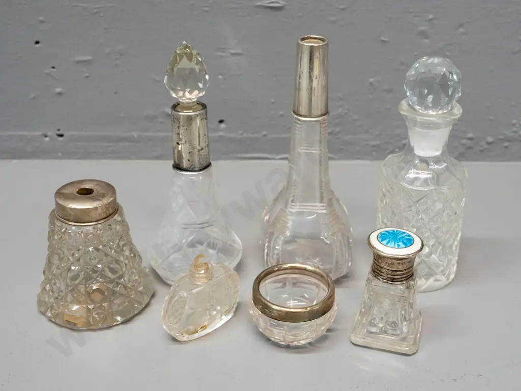6 vintage scent bottles and a small bowl, 4 w/ sterling silver caps or collars, one enamelled sterling. One missing Image 1++
