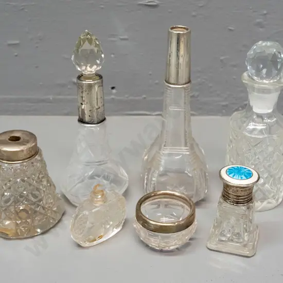 6 vintage scent bottles and a small bowl, 4 w/ sterling silver caps or collars, one enamelled sterling. One missing