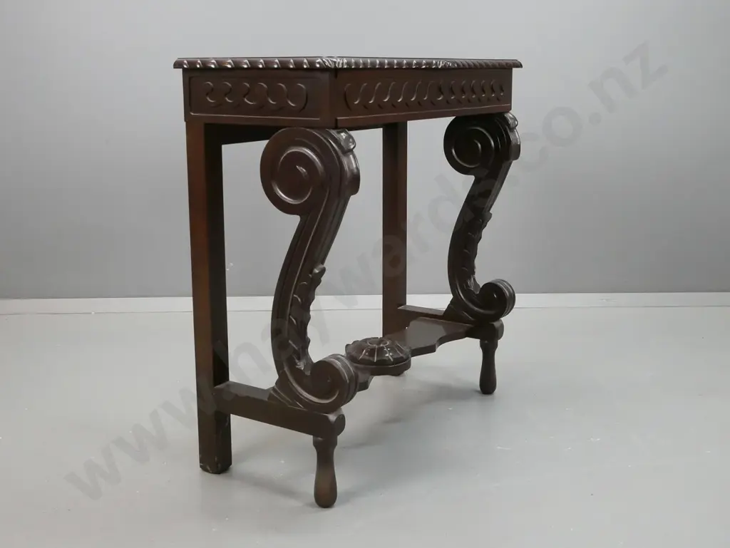reproduction mahogany console table with shaped edge, scrolling legs to platform base, stylized flower in stretcher, Image 1++