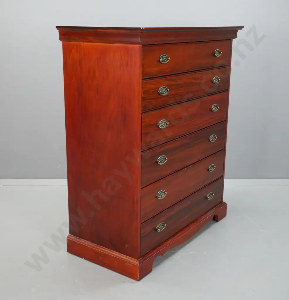 Reproduction 6 long drawer, pacific kauri chest,  with stepped top on shaped plinth, oval brass handles. Image 1++