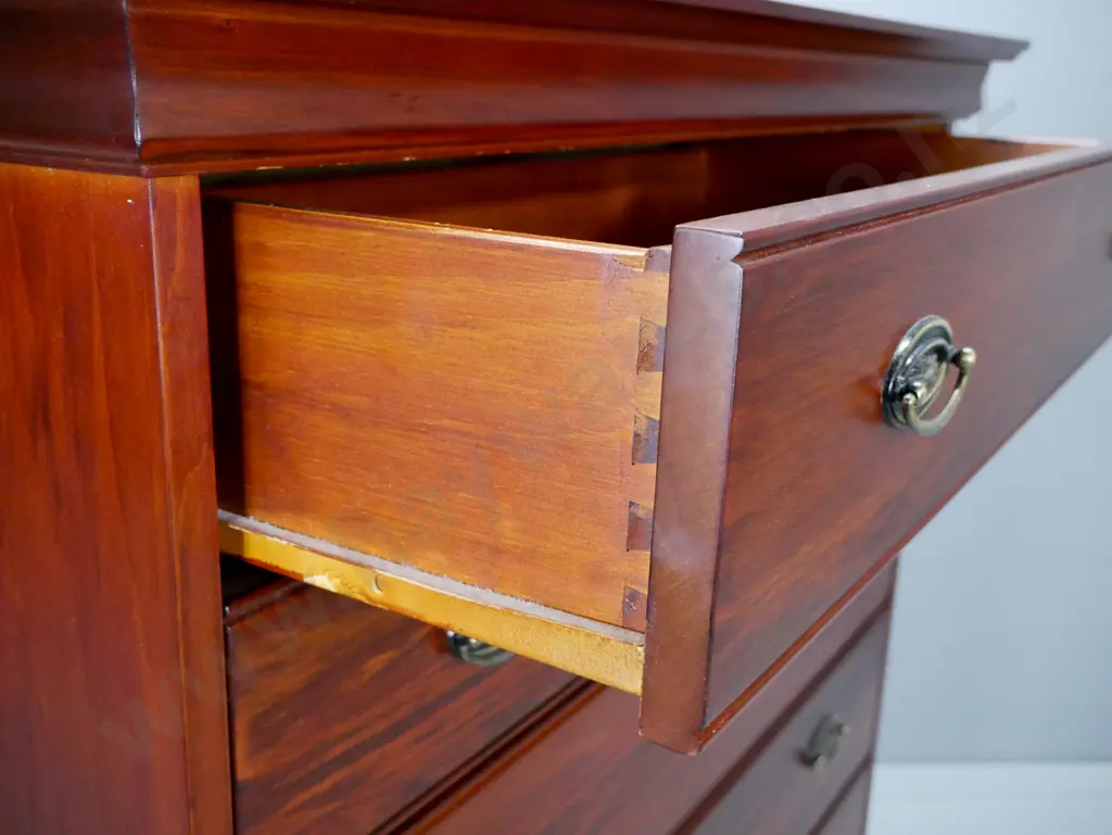 Reproduction 6 long drawer, pacific kauri chest,  with stepped top on shaped plinth, oval brass handles. Image 1++