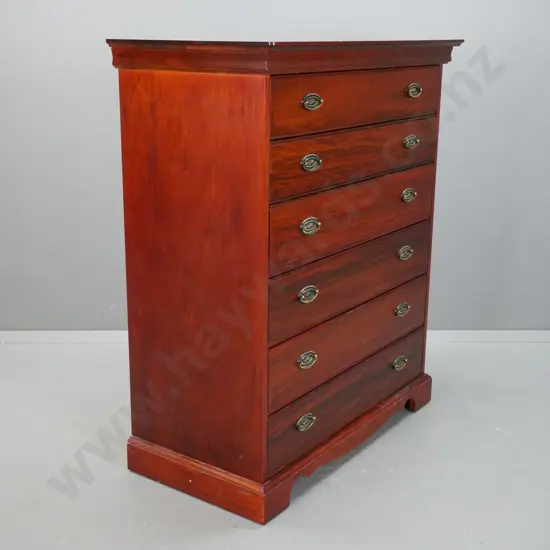 Reproduction 6 long drawer, pacific kauri chest,  with stepped top on shaped plinth, oval brass handles.
