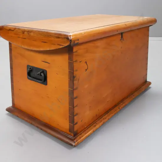 colonial kauri travel trunk with shaped top edge, hand-dovetailed sides, strap hinges and metal carry handles, missing