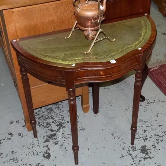 walnut half-round hall table with shaped frieze drawer, tooled leather inset top, on turned fluted legs - minor wear to