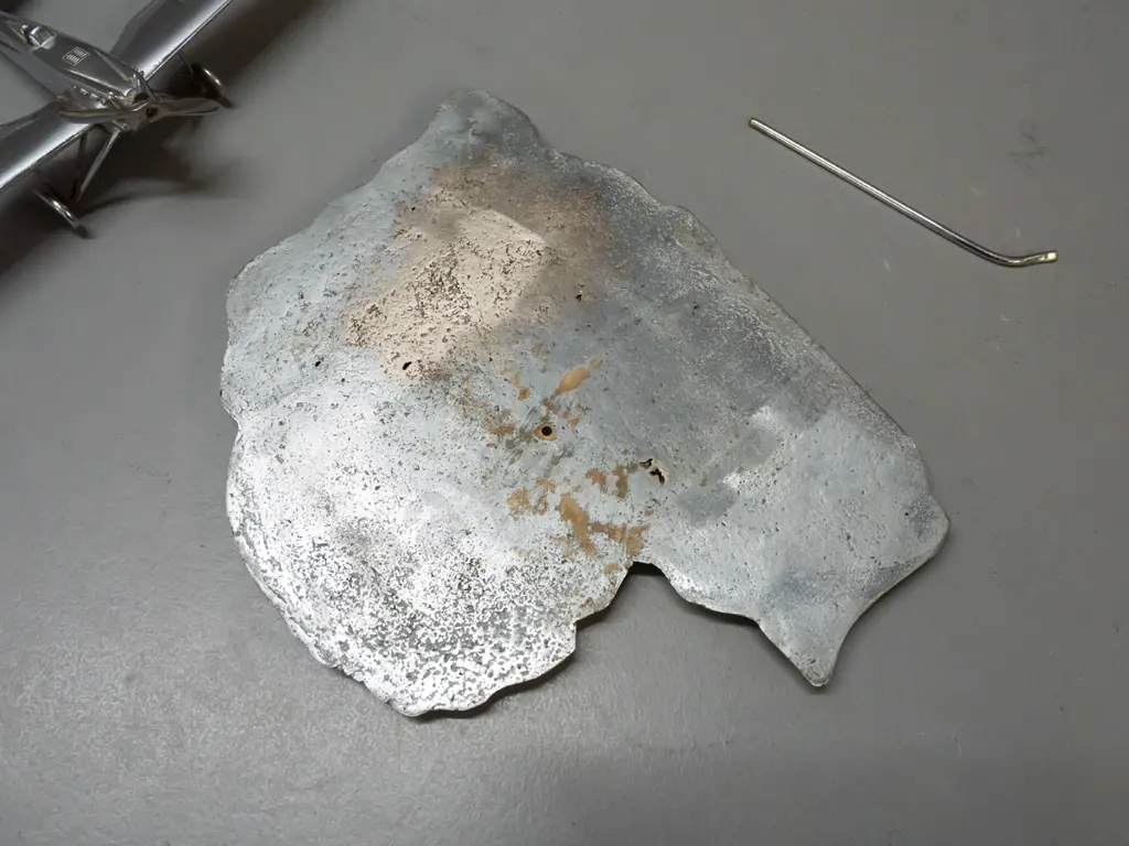 cast metal aeroplane model on heavy roughly cast base in shape of map of Lithuania, engraved with place names. Aeroplane Image 1++