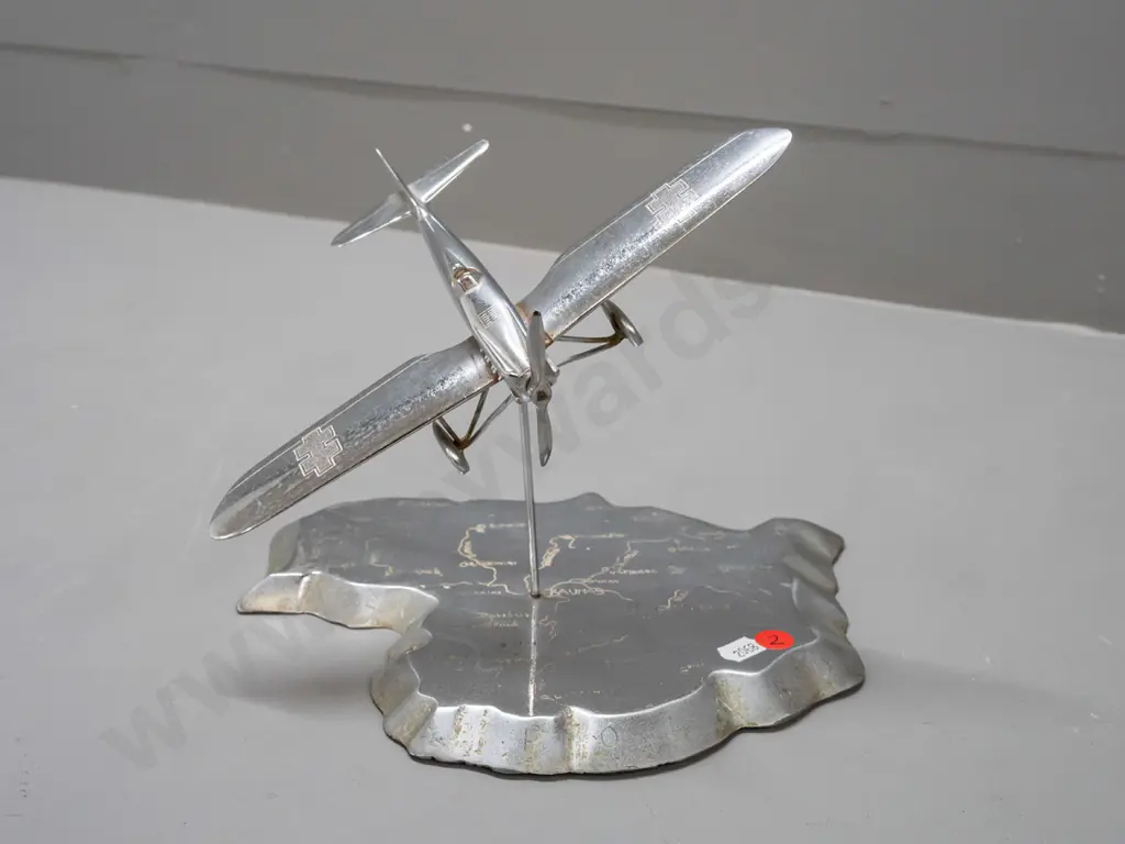 cast metal aeroplane model on heavy roughly cast base in shape of map of Lithuania, engraved with place names. Aeroplane Image 1++