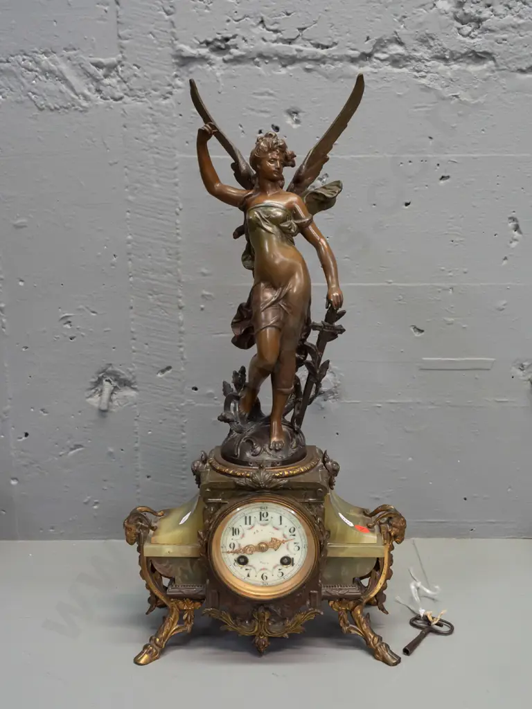 vintage mantel clock with winged angel (figure marked "France") on green onyx and ormolu decorated base with ram's Image 1++