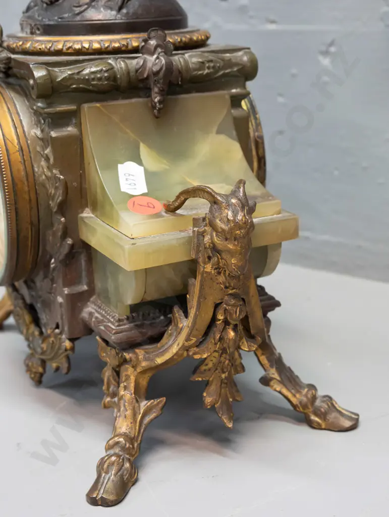 vintage mantel clock with winged angel (figure marked "France") on green onyx and ormolu decorated base with ram's Image 1++