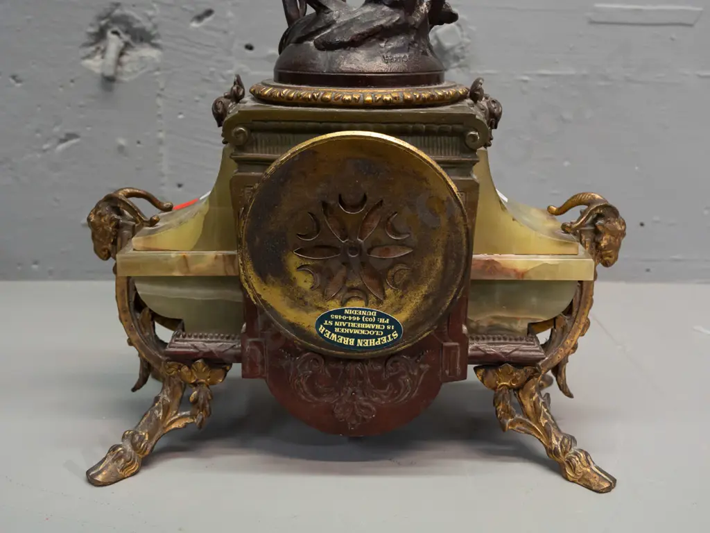 vintage mantel clock with winged angel (figure marked "France") on green onyx and ormolu decorated base with ram's Image 1++