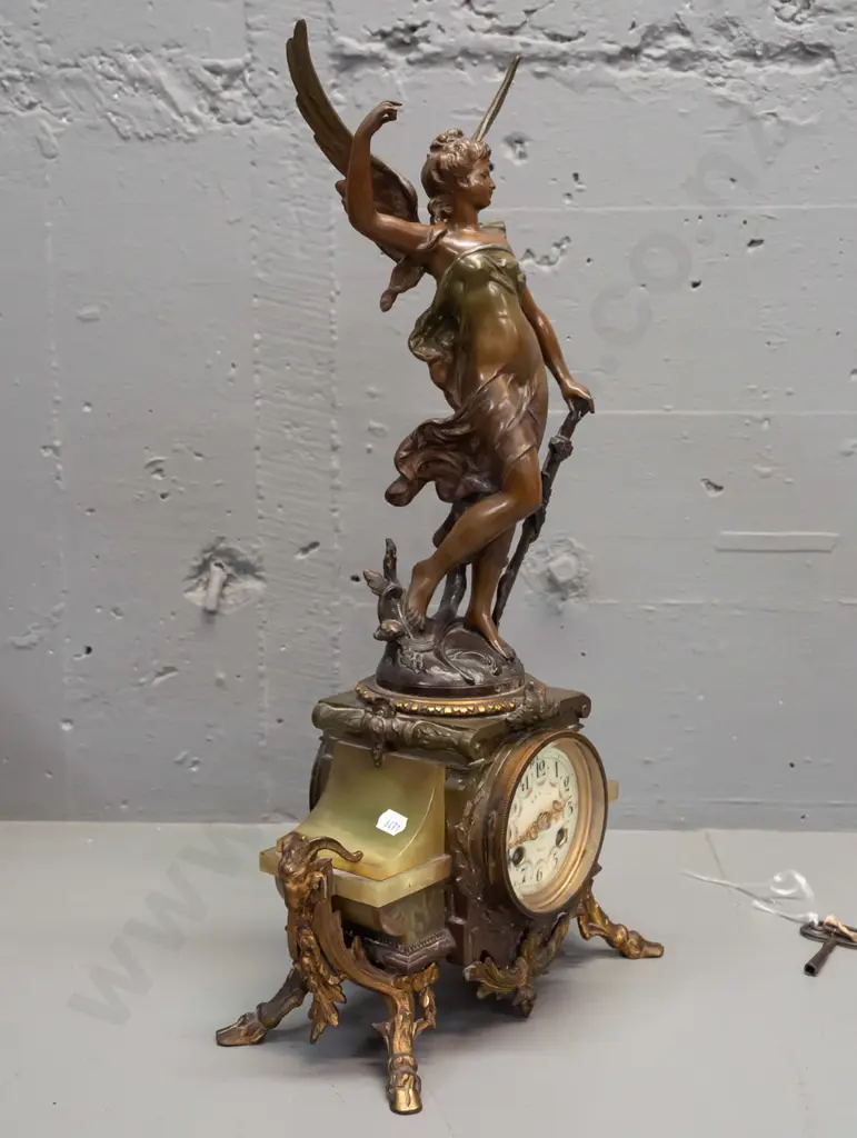 vintage mantel clock with winged angel (figure marked "France") on green onyx and ormolu decorated base with ram's Image 1++