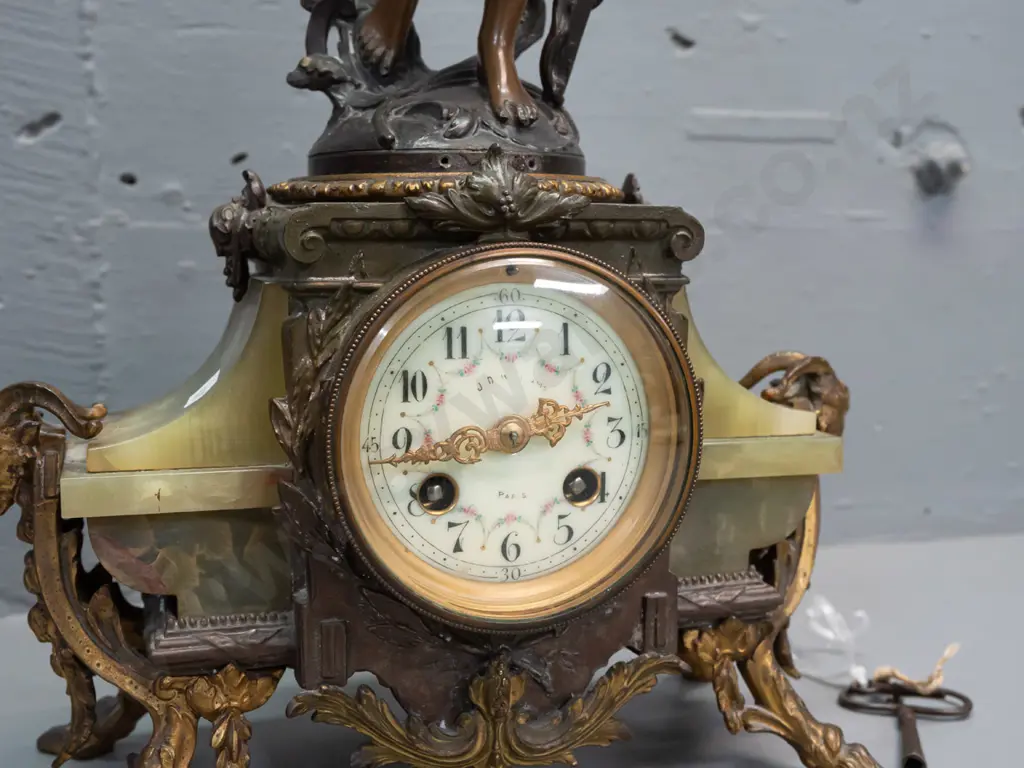 vintage mantel clock with winged angel (figure marked "France") on green onyx and ormolu decorated base with ram's Image 1++