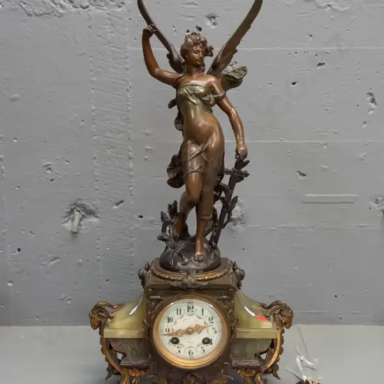 vintage mantel clock with winged angel (figure marked "France") on green onyx and ormolu decorated base with ram's