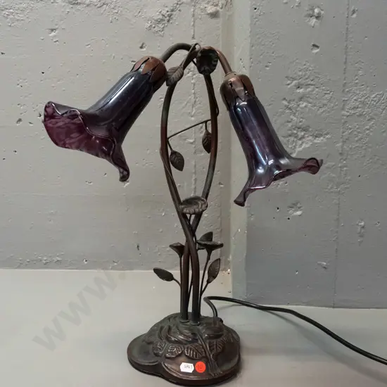 Tiffany style 2-light lily motif table lamp w/ cast metal base, twined foliage stem, purple mottled lustre glass shades