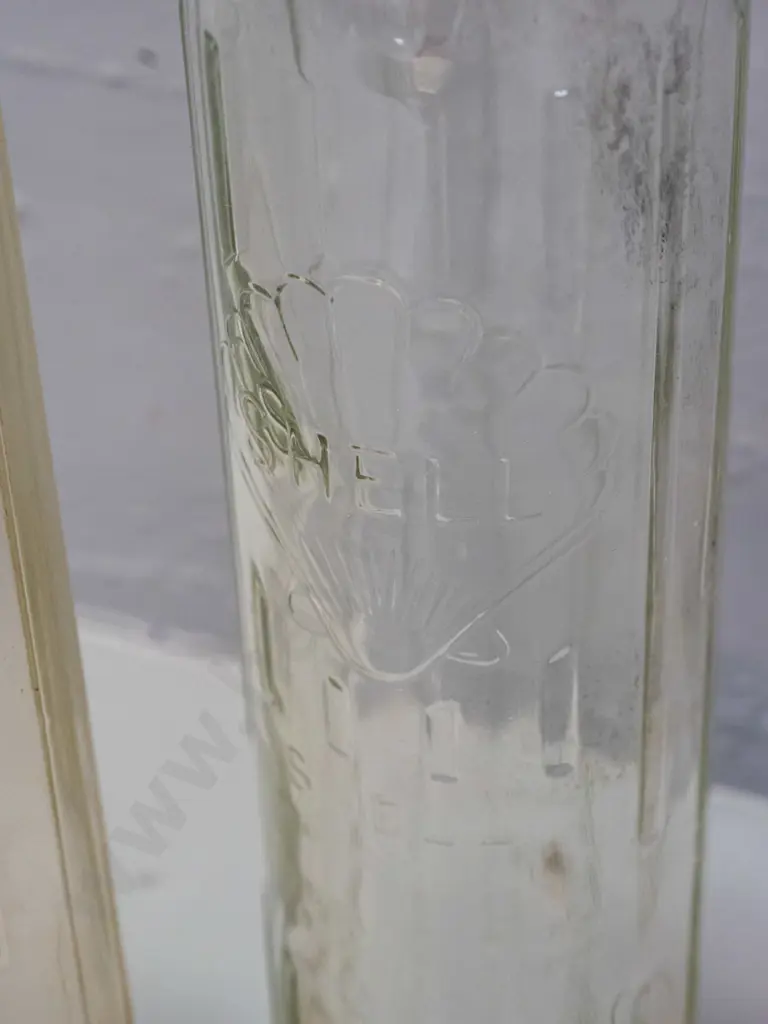 2 Shell New Zealand Ltd. clear glass quart oil bottles - one has oil residue H-370 Image 1++