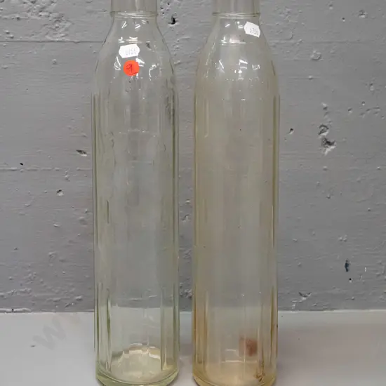 2 Shell New Zealand Ltd. clear glass quart oil bottles - one has oil residue H-370