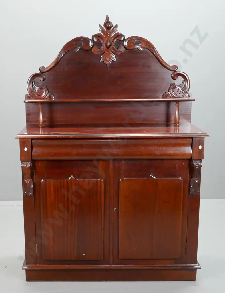 reproduction mahogany carved back chiffonier with shaped shelf over long shaped drawer, 2 doors with shield shape panels Image 1++