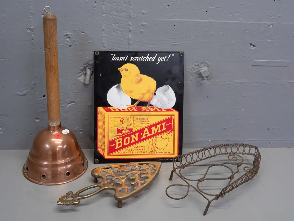 vintage wood-handled copper washing agitator, cast brass trivet, reproduction enamel sign H-240 W-200 and a wire trivet Image 1++