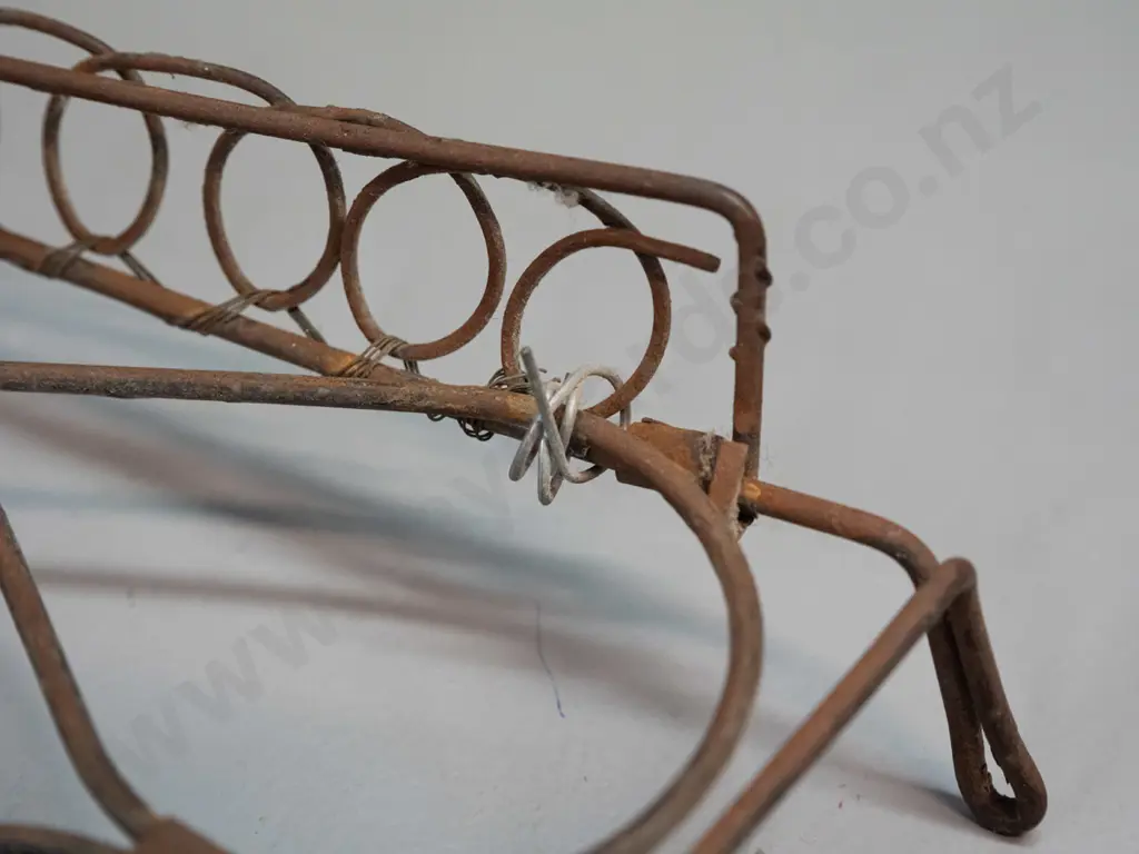 vintage wood-handled copper washing agitator, cast brass trivet, reproduction enamel sign H-240 W-200 and a wire trivet Image 1++