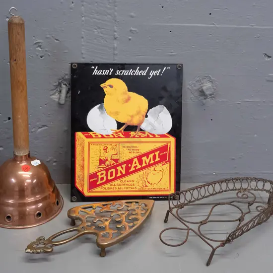 vintage wood-handled copper washing agitator, cast brass trivet, reproduction enamel sign H-240 W-200 and a wire trivet