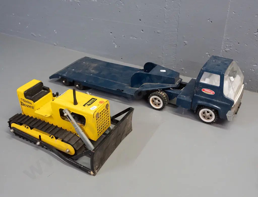 2 Tonka steel toy vehicles - Mighty Tonka dozer and a blue cab w/ flatbed trailer - Tonka New Zealand stickers on door Image 1++