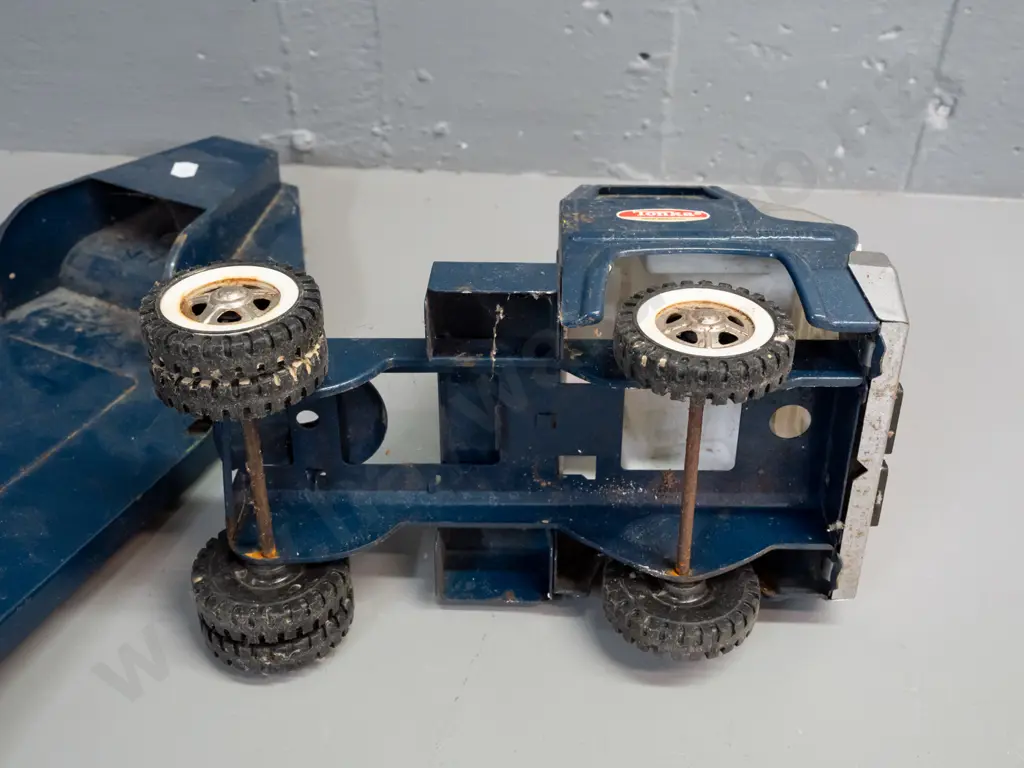 2 Tonka steel toy vehicles - Mighty Tonka dozer and a blue cab w/ flatbed trailer - Tonka New Zealand stickers on door Image 1++