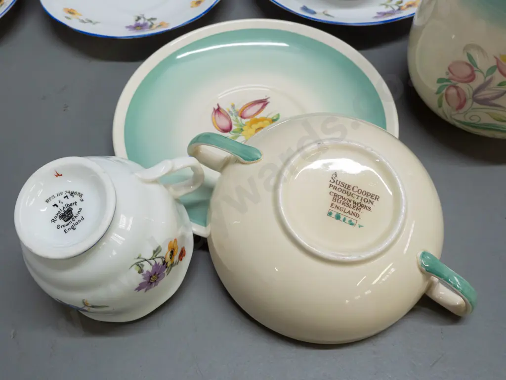 3 pieces Susie Cooper and 4 vintage Royal Albert cups & saucers with floral decoration and blue rims. Susie Cooper jug Image 1++