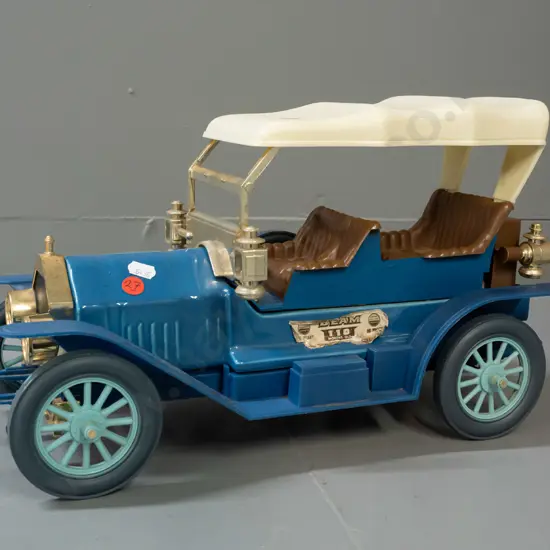 Jim Beam automotive decanter - Thomas Flyer, with contents, seal seems intact - wear to paper label, small crack in