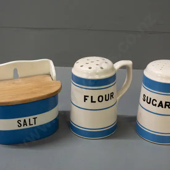 3 pieces of blue and white Cornish ware - wall hanging salt with wooden lid marked T&G Greene, sugar and flour